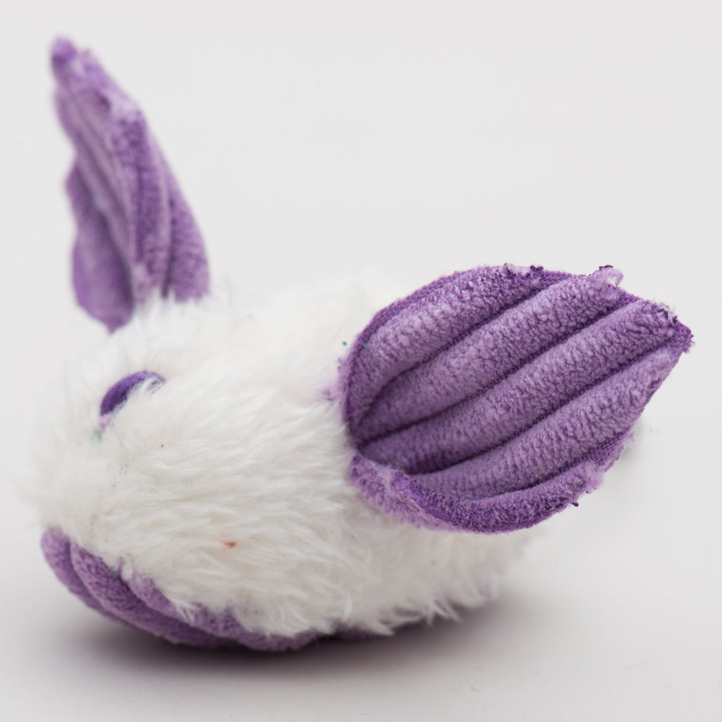 Plush toy with purple accents on a white background.