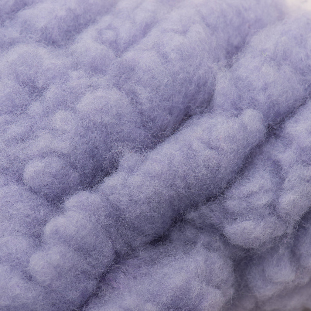 Close-up of fluffy purple dog bone toy.