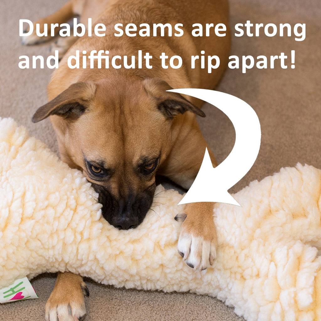 Dog playing with a plush toy on a carpeted floor, with text about durable seams.
