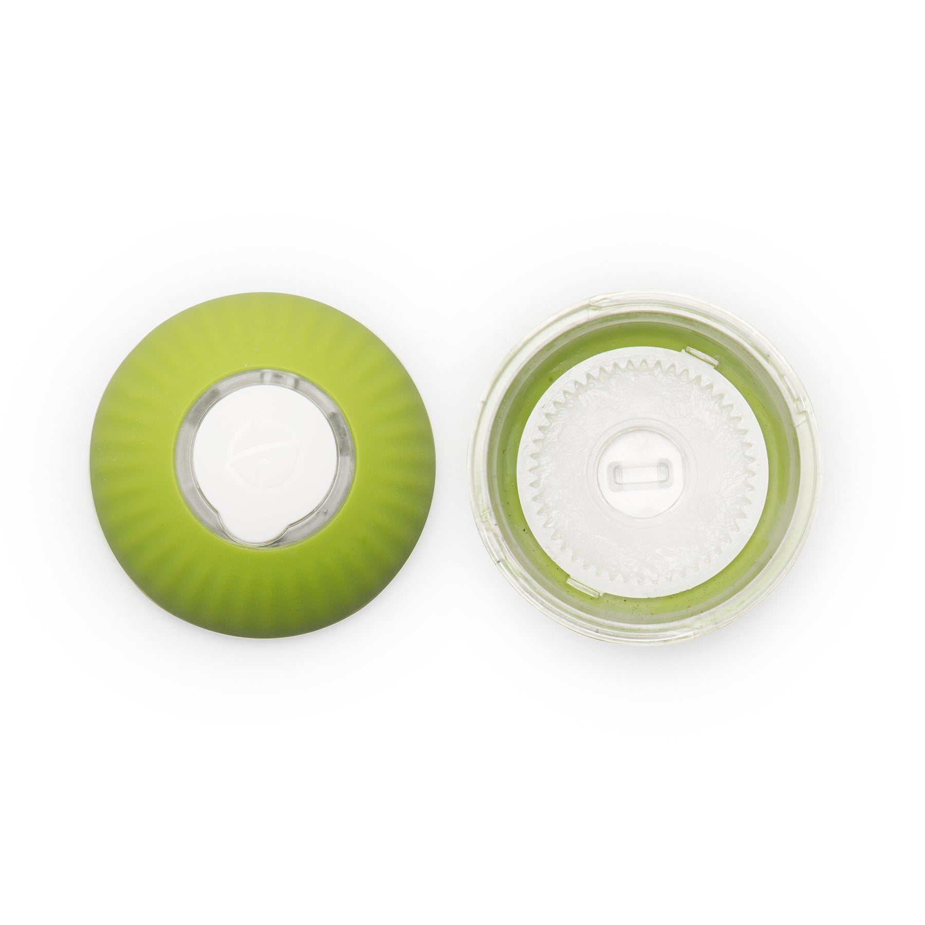 Green and clear plastic components on a white background.