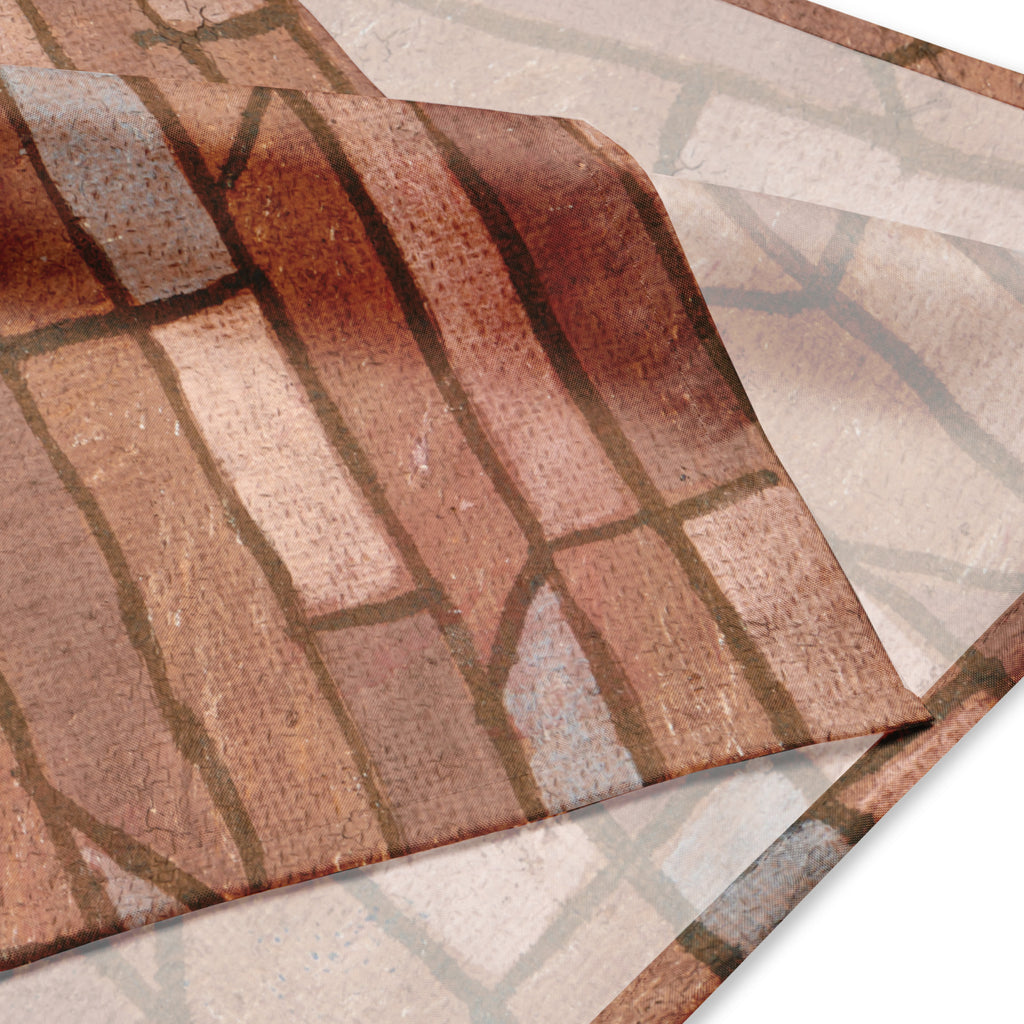 Close-up of a patterned bandana with brown and beige colors.