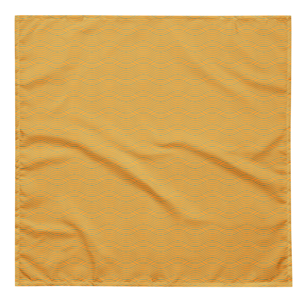 Orange fabric bandana with wavy pattern on a white background.
